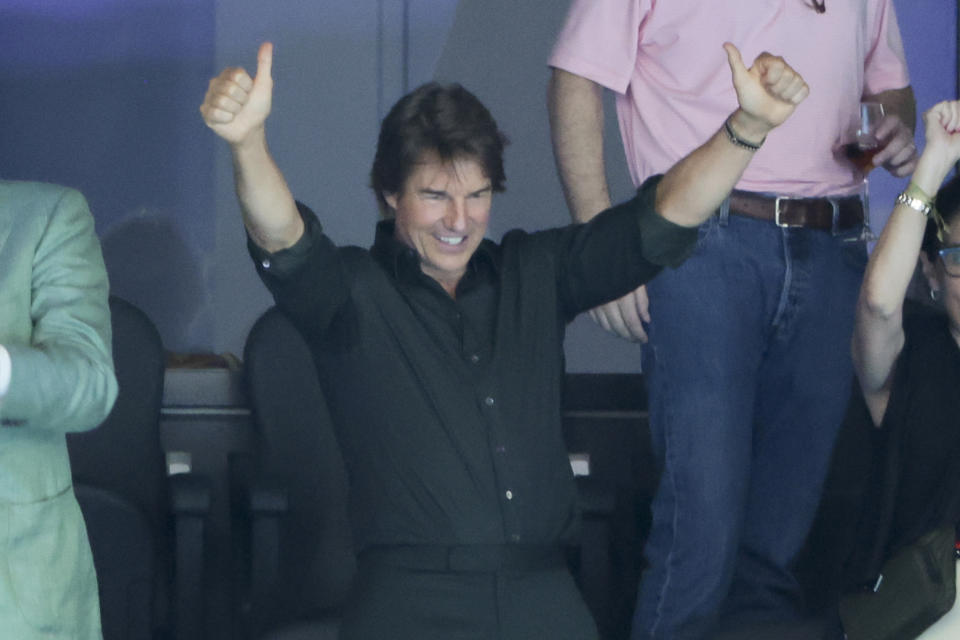 NANTERRE, FRANCE - JULY 27: Tom Cruise celebrates with the finish medal of the USA 4x100m freestyle relay during day one of the swimming competitions at the Paris La Defense Arena in Nanterre near Paris, France on July 27, 2024. (Photo by Jean Katouf/Getty Images)