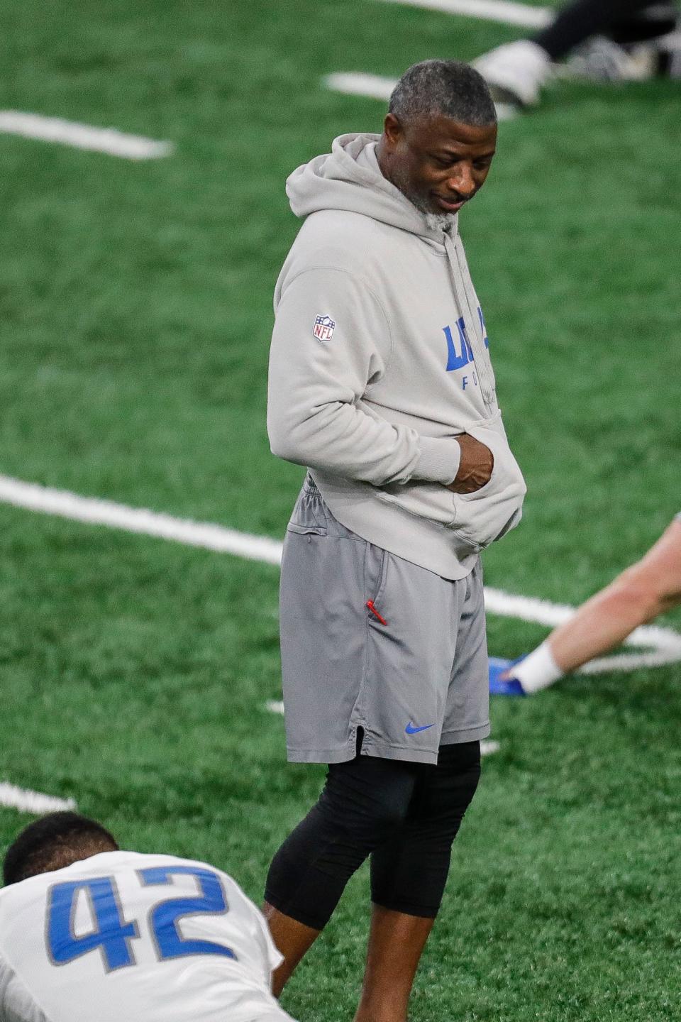 Detroit Lions defensive coordinator Aaron Glenn watches practice at Detroit Lions headquarters and training facility in Allen Park on Thursday, Jan. 25, 2024.