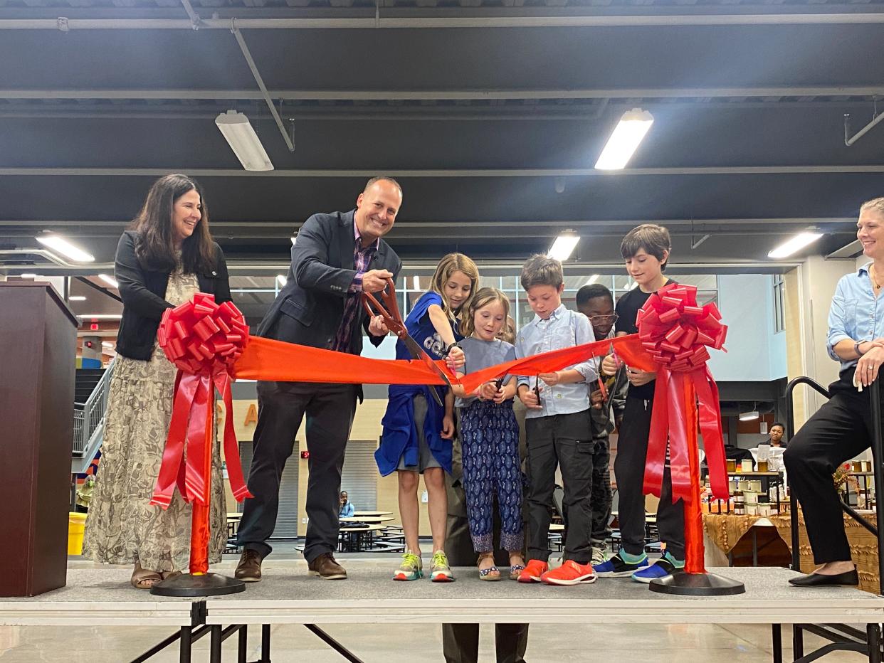 Principal Mike Heun and students Jonas, Max, Fitz, Ben, and Ruby (last names not provided) cut the ribbon at the Wilson Elementary and WSTEM ribbon cutting ceremony held on Wednesday, June 8.