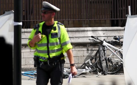 Bicycles lie on the ground at the scene of the crash outside the Houses of Parliament  - Credit: HANNAH MCKAY /Reuters