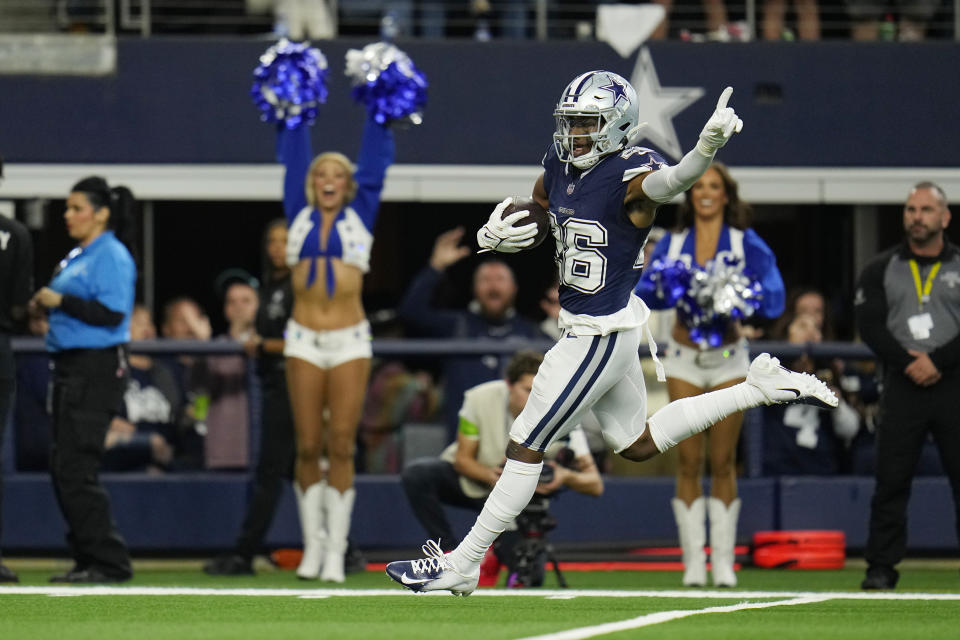 Dallas Cowboys cornerback DaRon Bland (26) celebrates as he returns an intercepted pass for a touchdown during the first half of an NFL football game against the Los Angeles Rams Sunday, Oct. 29, 2023, in Arlington, Texas. (AP Photo/Julio Cortez)