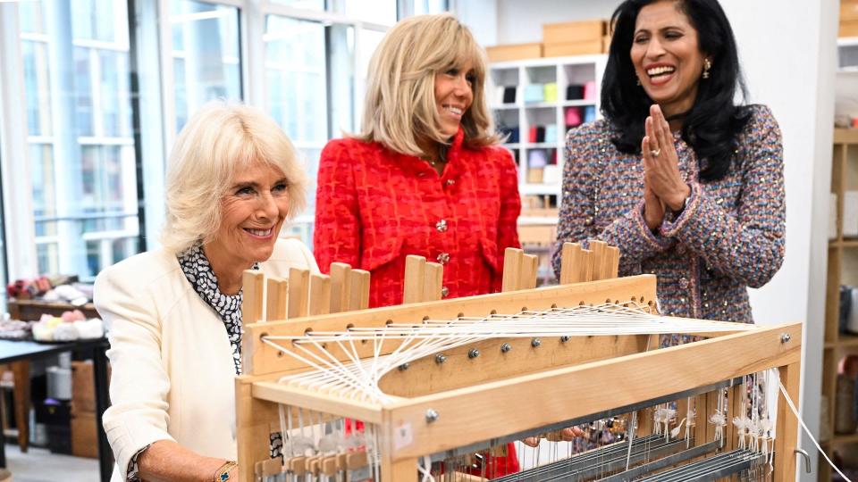 Britain's Queen Camilla and French President's wife Brigitte Macron, next to CEO of Chanel Leena Nair (R), visit the 19M Campus