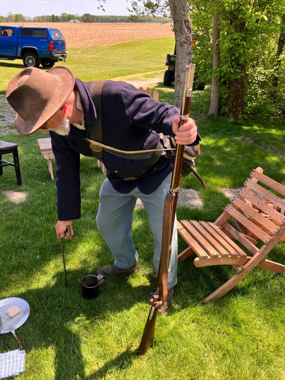 John Cauvel demonstrates that bayonet also can be used as a candle holder.