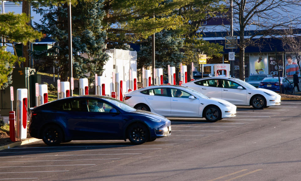 UNION CITY, NEW JERSEY - FEBRUARY 18: Vehicles sit at a Tesla charging station on February 18, 2023 in Union City, New Jersey. Tesla announced that it would, for the first time, open up the use of its charger stations to EVs made by other brands. On Feb. 15, the Biden-Harris Administration announced new plans for the decarbonization of the countrys roads by bolstering the EV charging network across the U.S. (Photo by Kena Betancur/VIEWpress via Getty Images)