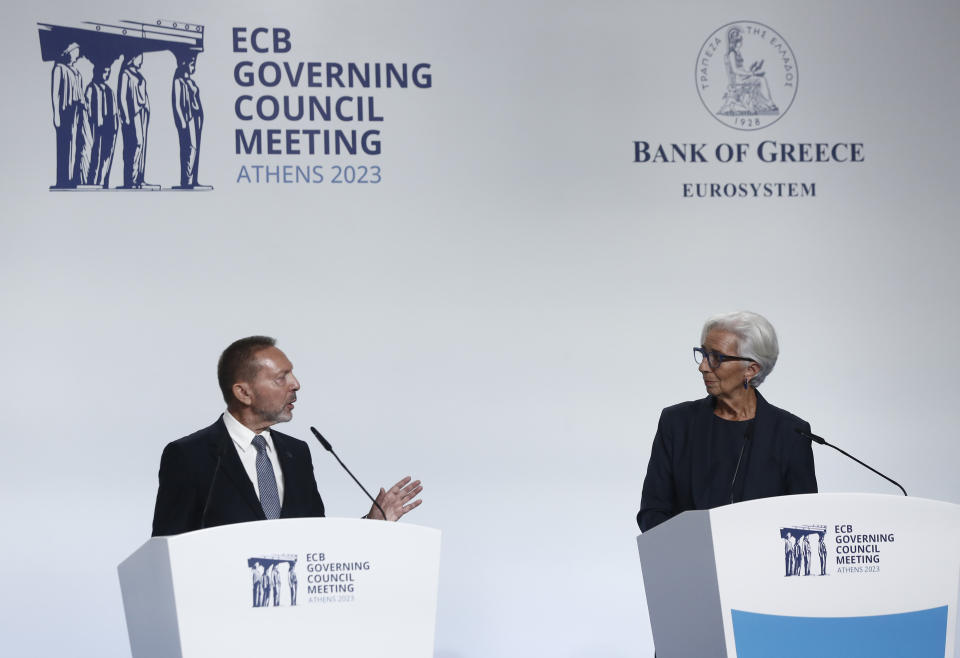 Bank of Greece governor Yannis Stournaras, left, makes statements as ECB President Christine Lagarde looks on during a press conference at the Bank of Greece, in Athens, Thursday, Oct. 26, 2023. The European Central Bank left interest rates unchanged Thursday for the first time in over a year as the Israel-Hamas war spreads even more gloom over already downbeat prospects for Europe's economy. (AP Photo)