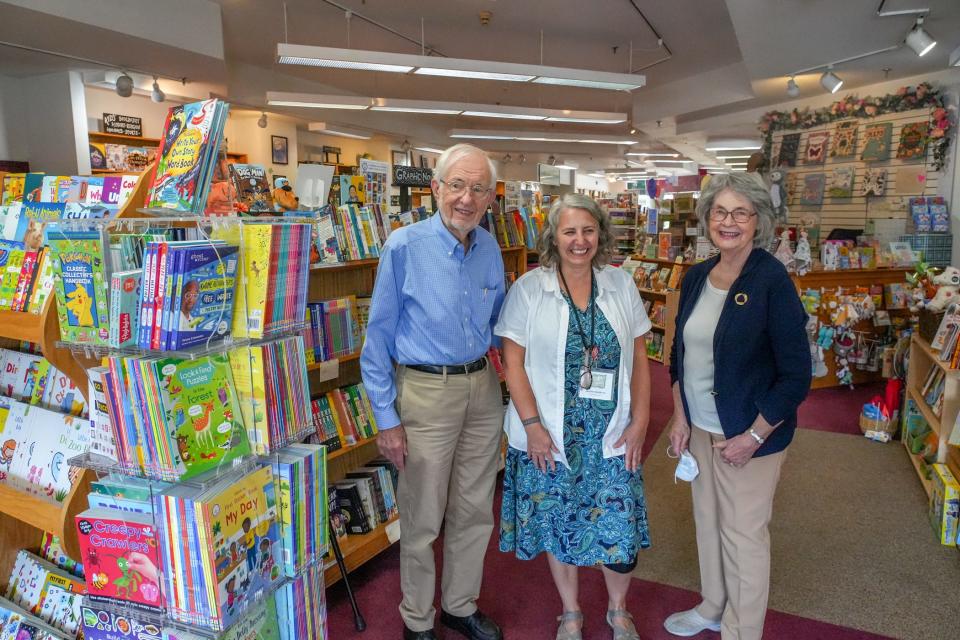 Books on the Square owners Rod and Merc Clifton, at left and right, with store manager Jennifer Kandarian. Rescued by the Cliftons 15 years ago, the Providence store just marked its 30th anniversary.