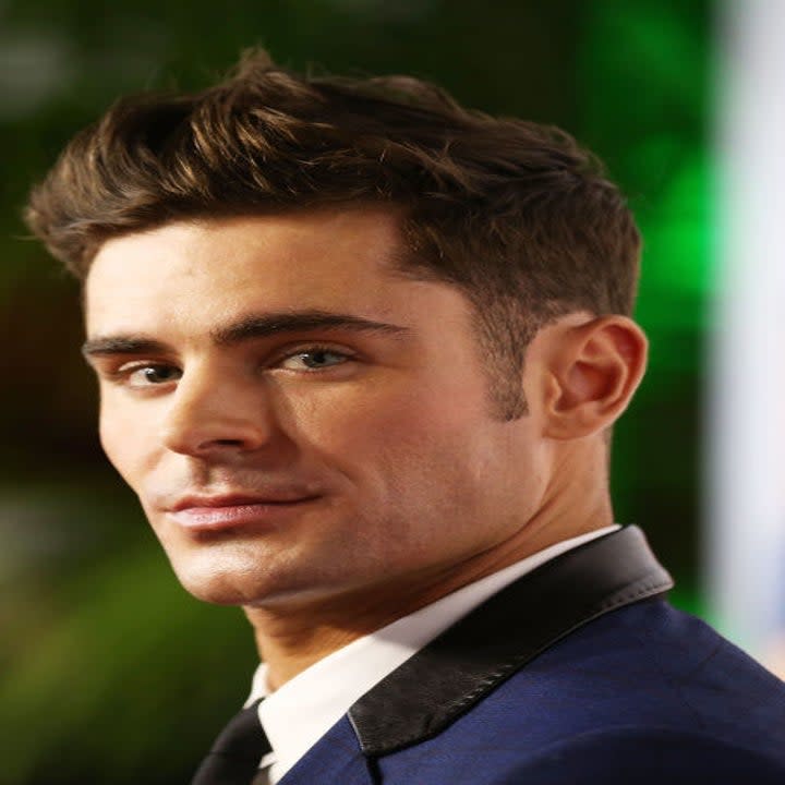 Zac Efron smiles on the red carpet