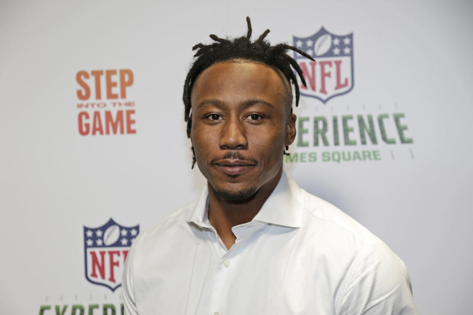 New York Giants Brandon Marshall poses for a picture at the opening of “NFL Experience” in Times Square, New York, Thursday, Nov. 30, 2017. (AP Photo/Seth Wenig)