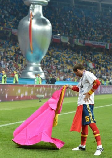 Spanish defender Sergio Ramos performs a Veronica pass with a matador cape after the Euro 2012 football championships final match Spain vs Italy at the Olympic Stadium in Kiev. Spain won 4-0