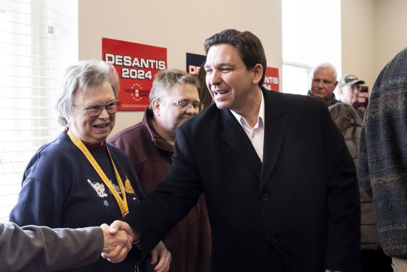 Republican presidential candidate and Florida Gov. Ron DeSantis shakes hands with voters during a campaign event in Atlantic, Iowa, on Saturday. DeSantis, former South Carolina Gov. Nikki Haley and former President Donald Trump are campaigning across Iowa in the final days before the state holds its first-in-the-nation caucus on Monday. Photo by Justin Lane/EPA-EFE