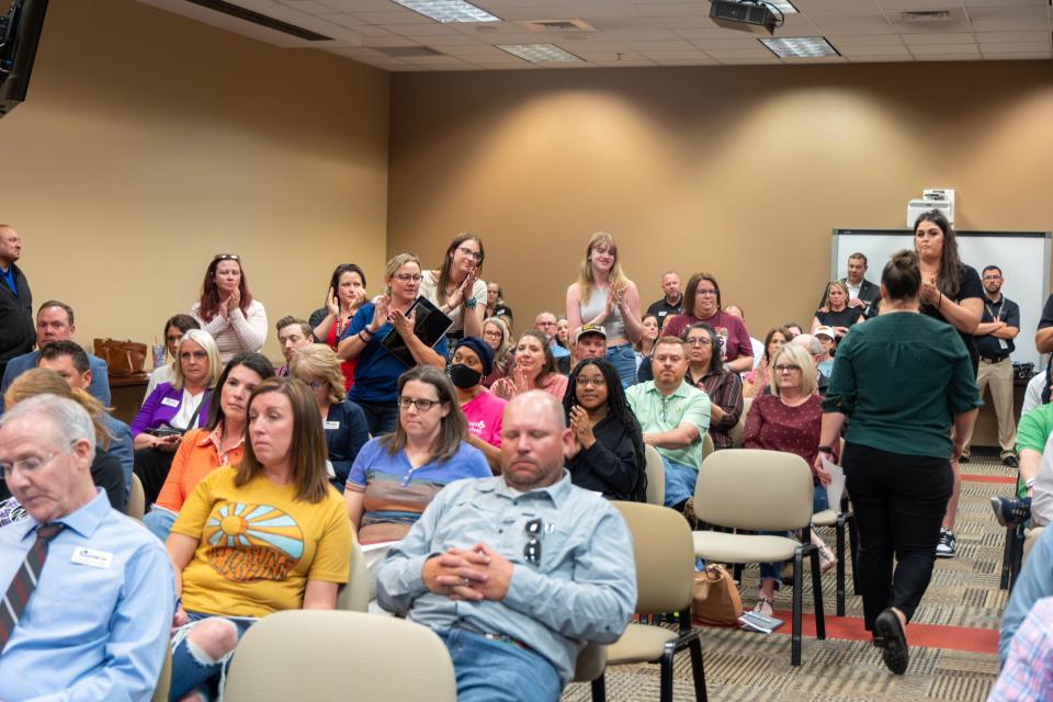 Members of the public give a standing ovation to Carolyn Baum after she condemned Paul Blake's public remarks about the LGBTQIA+ community during a Canyon Independent School District meeting Monday night in Canyon.