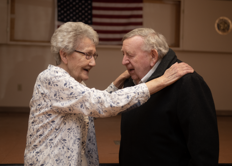 Janet Esposito visits with Ravenna Mayor Frank Seman during a recent reception for her. Esposito retired after seven terms as the Portage County auditor.