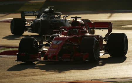 FILE PHOTO: Motor Racing - F1 Formula One - Formula One Test Session - Circuit de Barcelona-Catalunya, Montmelo, Spain - March 9, 2018. Kimi Raikkonen of Ferrari and Valtteri Bottas of Mercedes during testing. REUTERS/Albert Gea/File photo