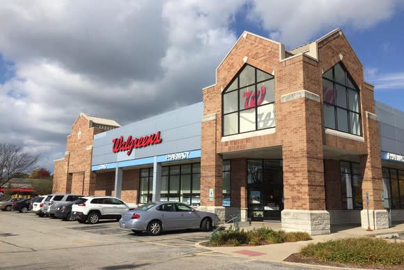 Walgreens store with cars parked in front