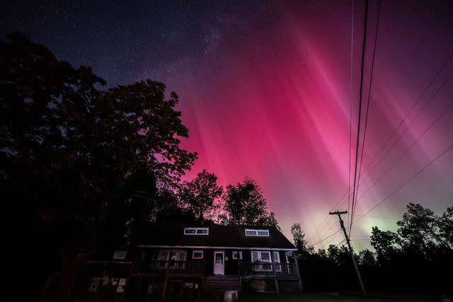 <p>Fatih Aktas/Anadolu via Getty</p> Perseid meteor shower is observed as Northern Lights (Aurora Borealis), colorful lights shift, illuminate the sky of New York, United States on August 12, 2024