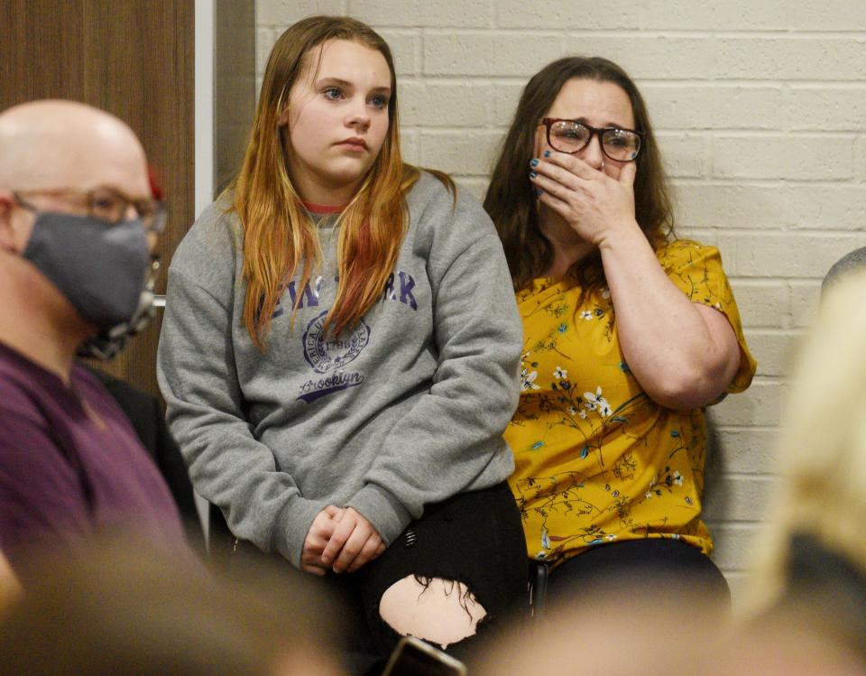 Laura Statos, right, gets emotional with her daughter, Catelyn Statos, listening to a person speak to the Caddo Parish school board about a nonbinary teacher Tuesday afternoon, March 15, 2022 at the Caddo Parish School board meeting.