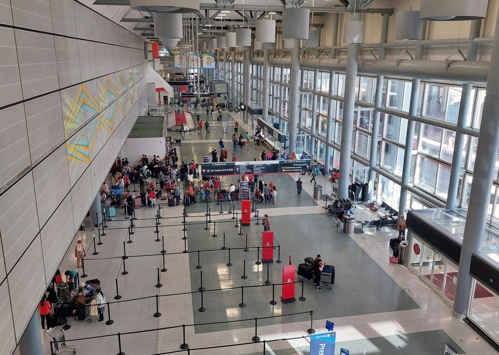 Passengers check-in at the Terminal D ticketing hall at George Bush Houston Intercontinental Airport.