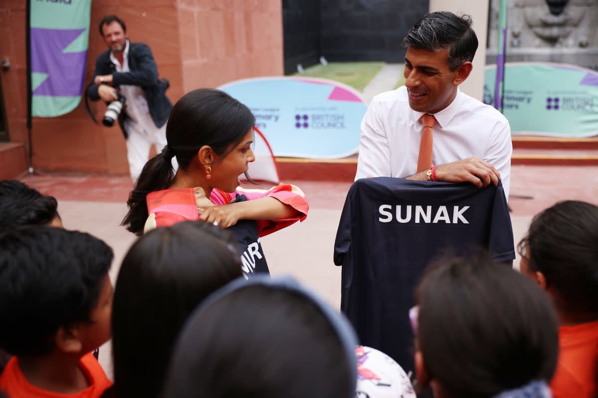 Prime Minister Rishi Sunak and his wife Akshata Murty meet local schoolchildren at the British Council during an official visit ahead of the G20 Summit in New Delhi, India (Dan Kitwood/PA) (PA Wire)