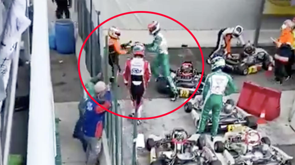 Luka Corberi, pictured here attacking his rival in the pits after the race.