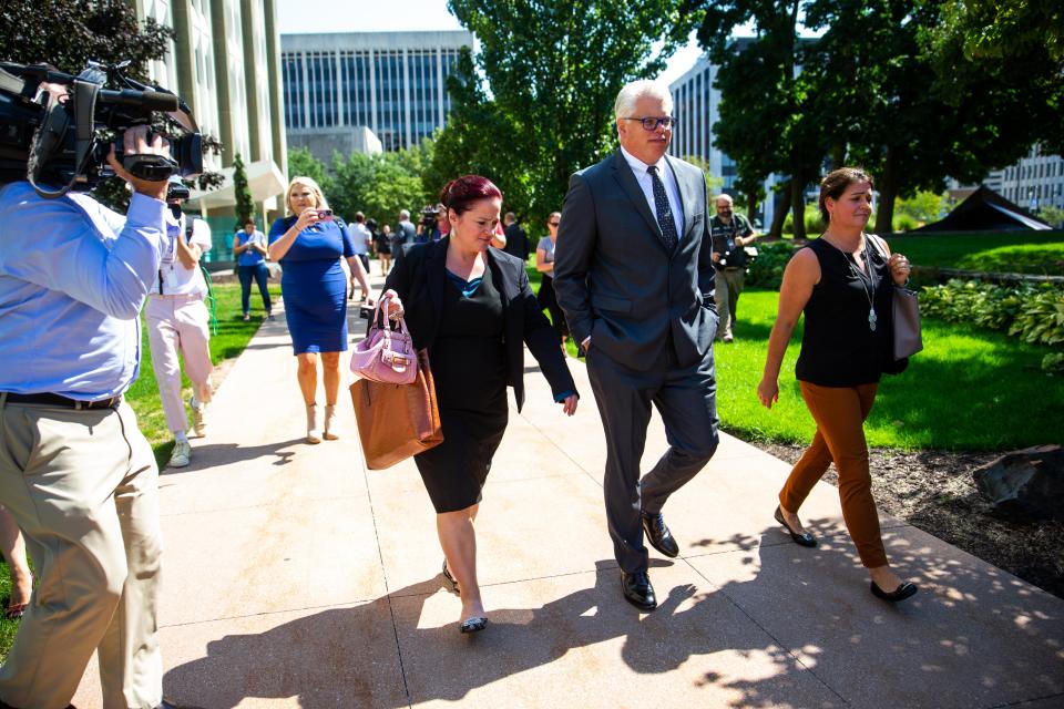 Attorney Christopher Gibbons walks out of the courtroom to the parking lot after his client, Adam Fox, was found guilty on all counts including kidnapping conspiracy and conspiracy to possess weapons of mass destruction Tuesday, Aug. 23, 2022, in downtown Grand Rapids.