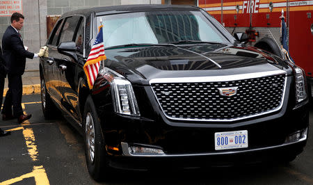 A U.S. Secret Service agent polishes U.S. President Donald Trump's brand new version of the General Motors built Cadillac presidential limousine known as "The Beast" as it awaits its debut drive with the president aboard in New York City, New York, U.S., September 23, 2018. Picture taken September 23, 2018. REUTERS/Mike Segar