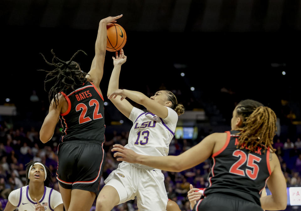 Georgia forward Malury Bates (22) blocks a shot by LSU guard Last-Tear Poa (13) in the first half of an NCAA college basketball game in Baton Rouge, La., Thursday, Feb. 2, 2023. (AP Photo/Derick Hingle)