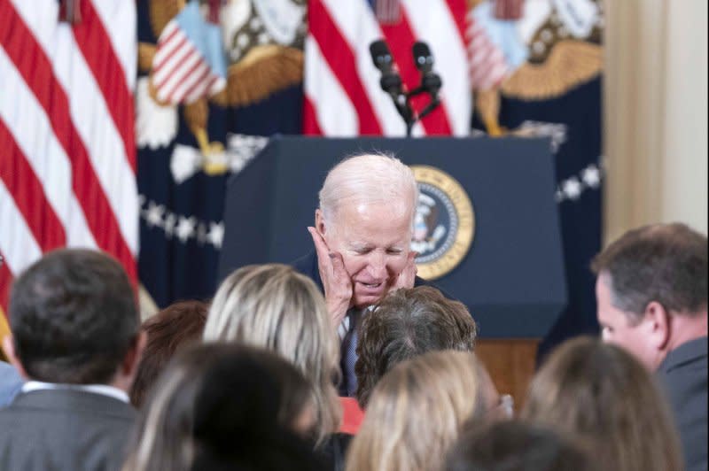 Rep. Jan Schakowsky, D-Ill., embraces President Joe Biden during an event on lowering healthcare costs in the East Room of the White House on Tuesday. Photo by Bonnie Cash/UPI