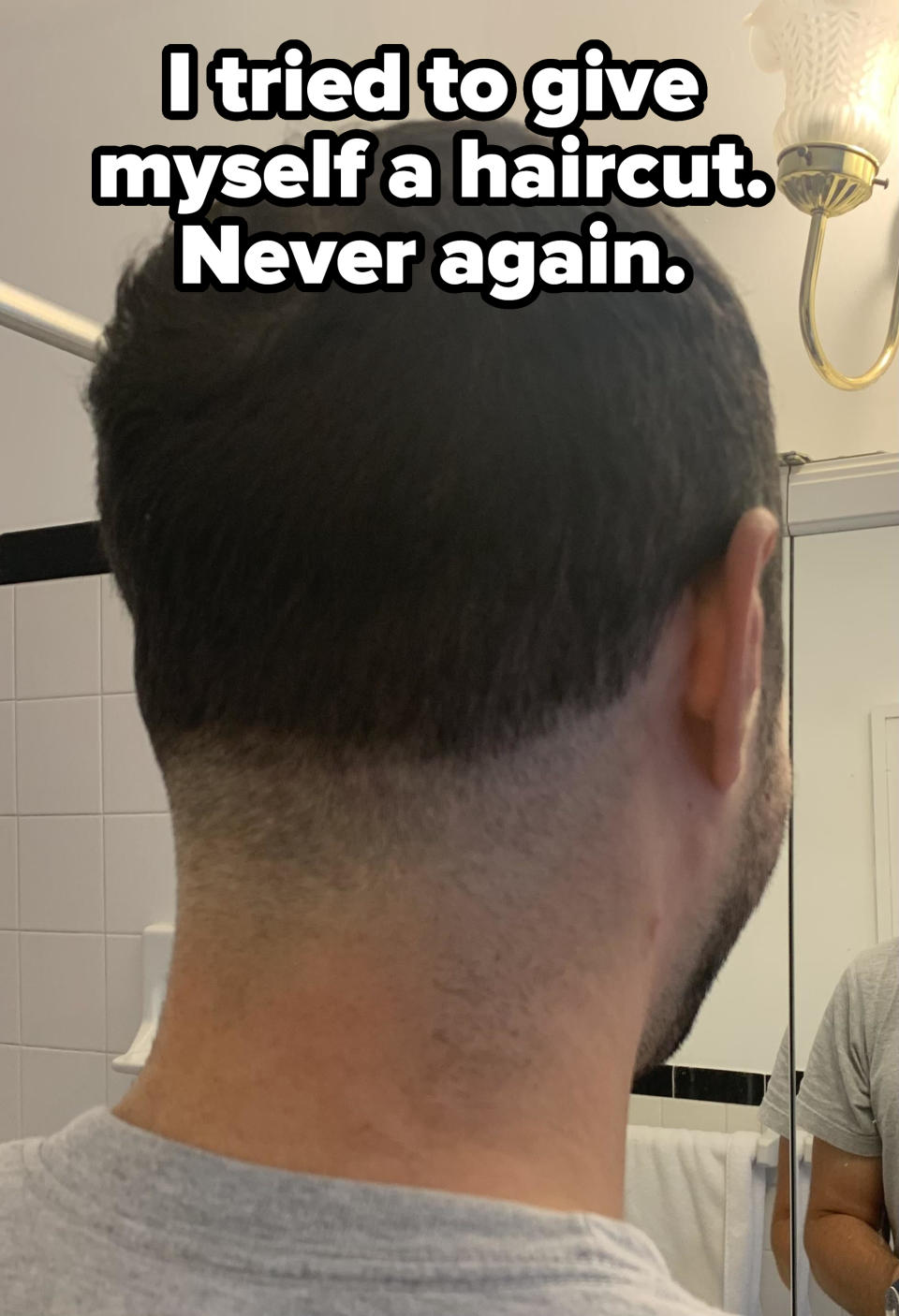 Person with a short back and sides haircut, viewed from the side