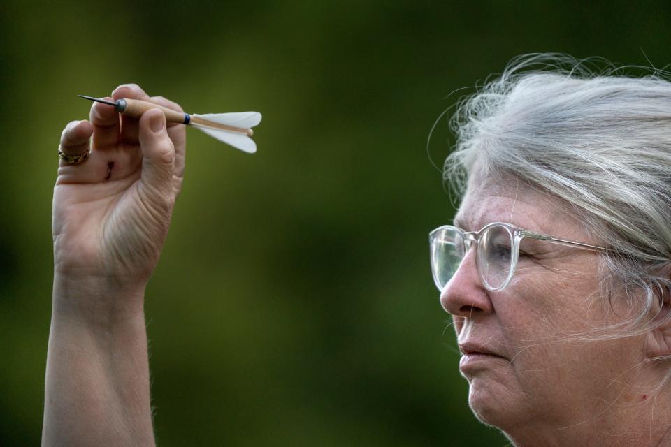 Brenda Sutton, whose SCA name is L’adan Lith‡n, throws darts during a weapon throwing activity, as members of Barony of Sternfeld gather for fighting practice and weapon throwing at Washington Township Park, Tuesday, Aug. 30, 2022 in Avon. The local chapter of the international Society of Creative Anachronism gathers for practice weekly when not off participating in activity around the country. Other thrown weapons are axes, knives and spears.