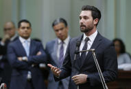 Assemblyman Ian Calderon, D-Whittier, urges lawmakers to approve a measure to give new wage and benefit protections at the so-called gig economy companies like Uber and Lyft, during the Assembly session in Sacramento, Calif., Wednesday, Sept. 11, 2019. The bill AB5, by Assemblywoman Lorenza Gonzalez, D-San Diego, was approved and now goes to the governor, who has said he supports it. (AP Photo/Rich Pedroncelli)