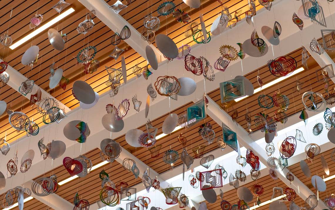 Artwork by Nick Cave titled “The Air Up There” hangs from the ticketing building at the new Kansas City International Airport terminal on Saturday, Feb. 18, 2023, in Kansas City.