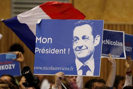 Political supporters hold a poster which reads, "My President" as France's former president Nicolas Sarkozy who attends a political rally as he campaigns for the leadership of the UMP political party in Lambersart, northern France, September 25, 2014. REUTERS/Pascal Rossignol