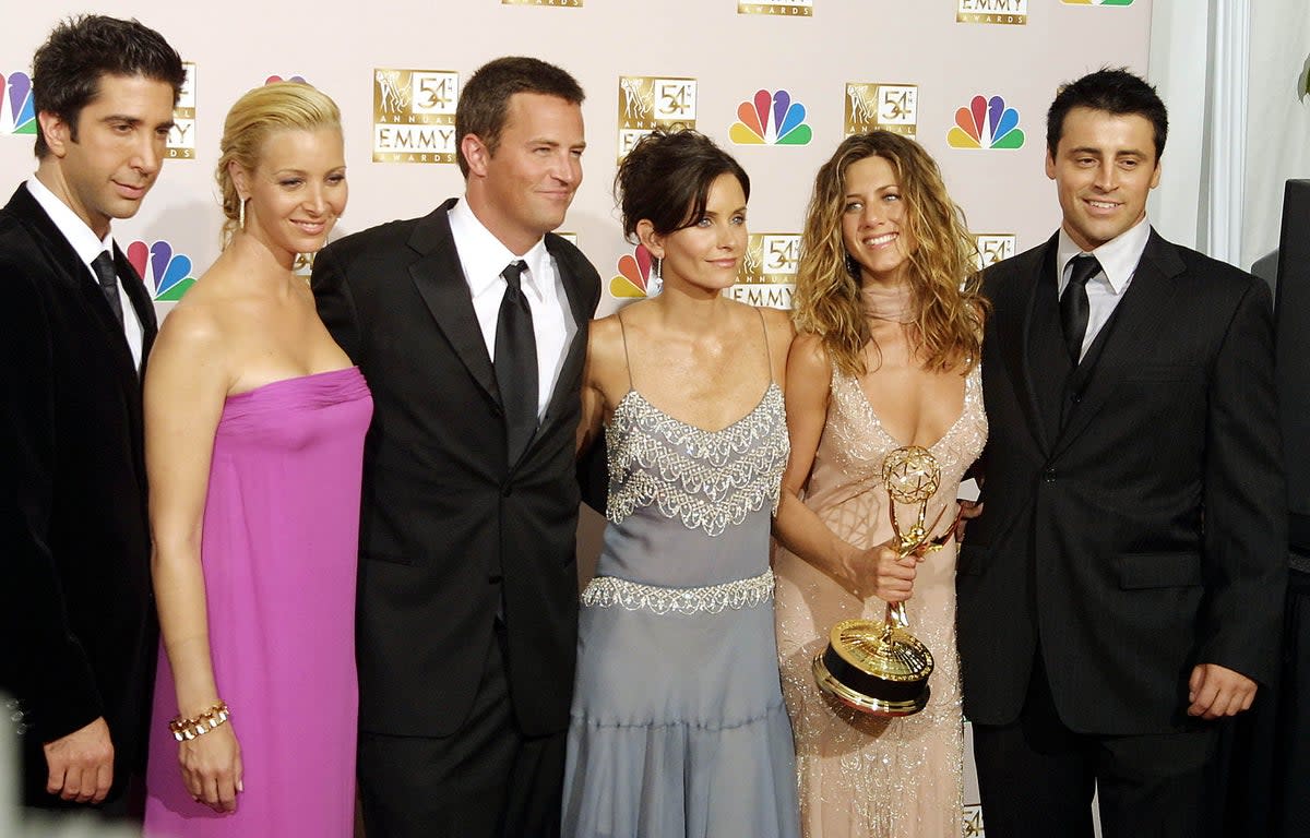 Stars of Friends pose at the 54th Annual Emmy Awards at the Shrine Auditorium in Los Angeles 22 September 2002.  (AFP via Getty Images)