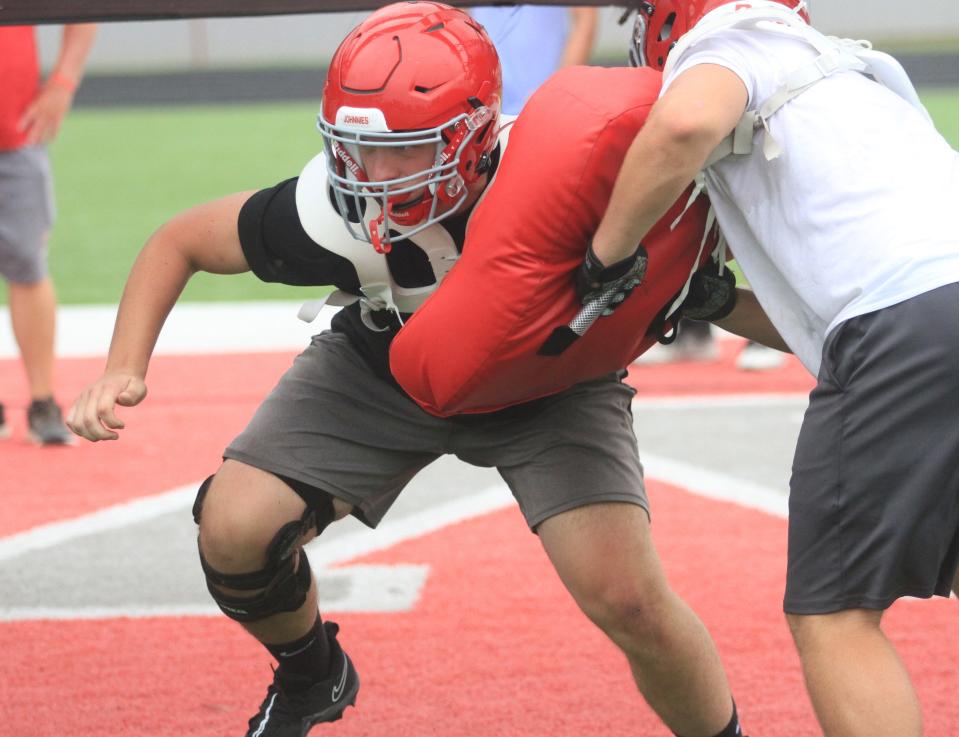 Johnstown's Brody Thompson fights off a block in a defensive line drill during a team camp at Frank H. Chambers Stadium on Thursday, July 27, 2023.