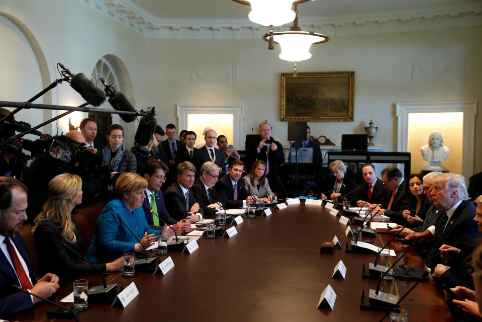 Germany's Chancellor Angela Merkel (3rd L) and U.S. President Donald Trump hold a roundtable discussion on vocational training at the White House in Washington, U.S. March 17, 2017. REUTERS/Jonathan Ernst