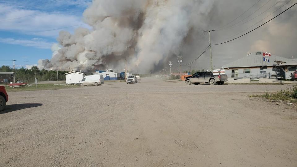 About 300 people have evacuated as a burns close to the community of Fort Good Hope, N.W.T. 