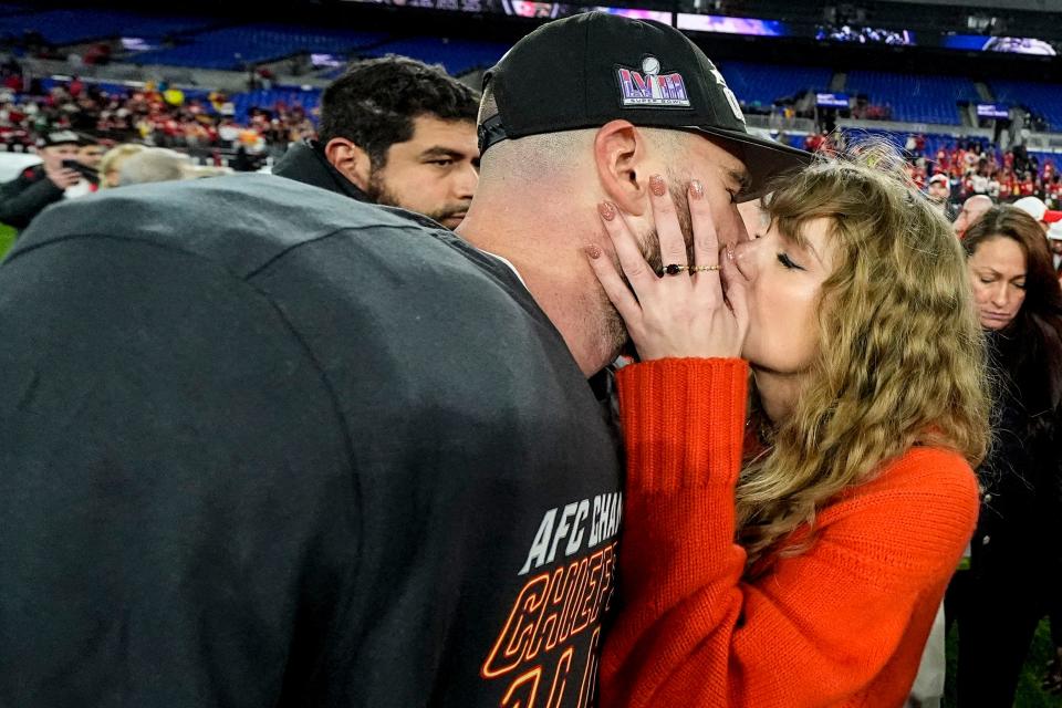 Taylor Swift kisses Kansas City Chiefs tight end Travis Kelce after an AFC Championship NFL football game against the Baltimore Ravens, Sunday, Jan. 28, 2024, in Baltimore. The Kansas City Chiefs won 17-10. (AP Photo/Julio Cortez) ORG XMIT: AFC518