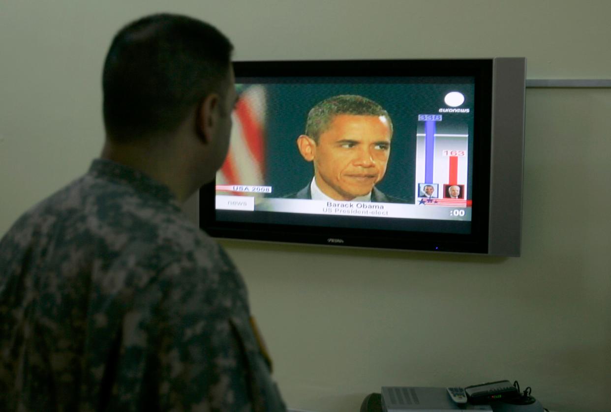 A U.S soldier in Baghdad, Iraq, watches U.S. President-elect Barack Obama on television on Nov. 5, 2008.