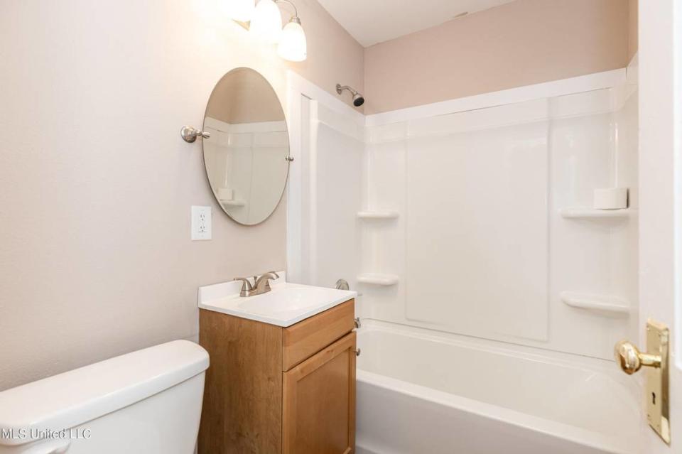 One of two baths is pictured in a four-bedroom house for sale on Convent Avenue in Pascagoula.