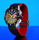 <p>Front view of the Tag Heuer Connected Limited Edition Super Mario with a black-and-red strap against a blue background.</p> 