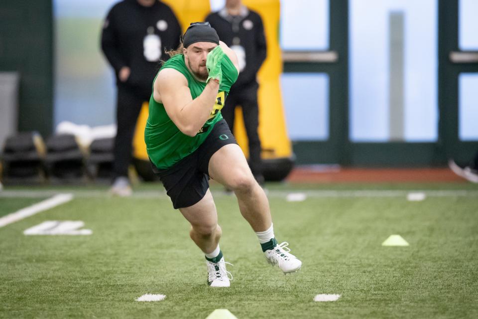 Oregon defensive lineman Casey Rogers runs drills during Oregon Pro Day Tuesday, March 12, 2024 at the Moshofsky Center in Eugene, Ore.