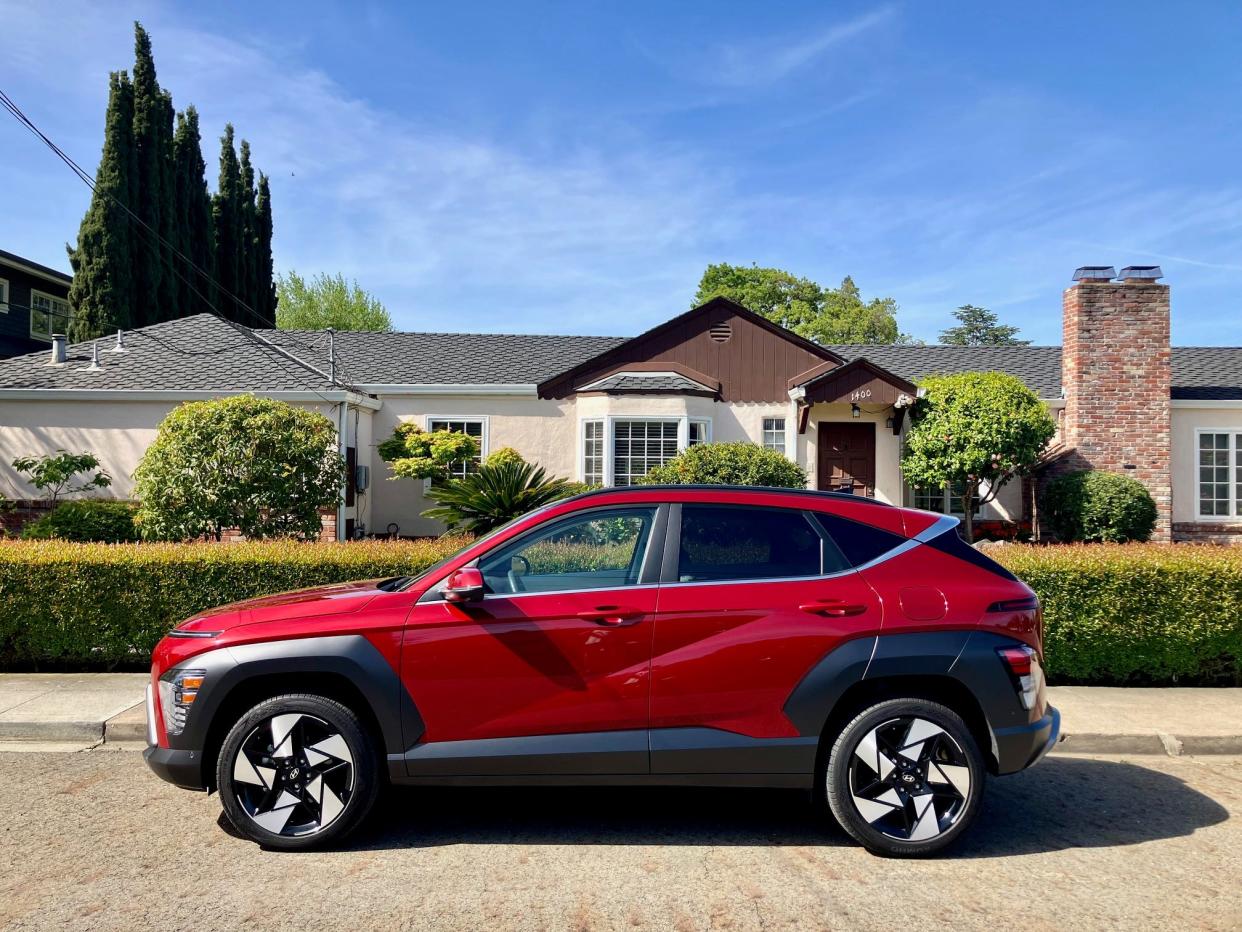 The 2024 Hyundai Kona Limited AWD parked on a suburban street.