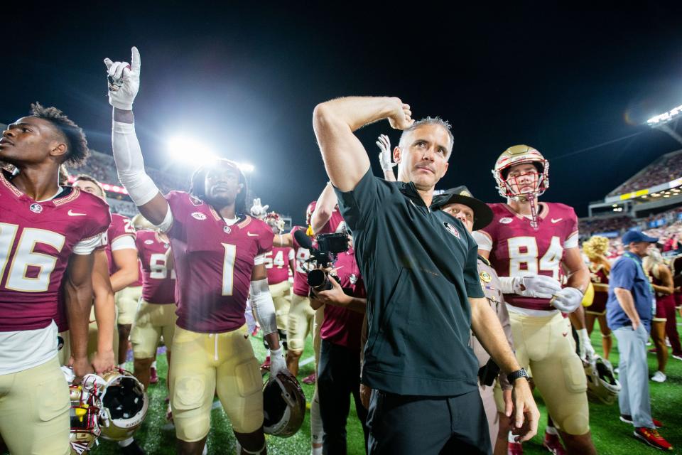 The Florida State Seminoles celebrate their 45-24 victory over the LSU Tigers at Camping World Stadium on Sunday, Sept. 3, 2023.