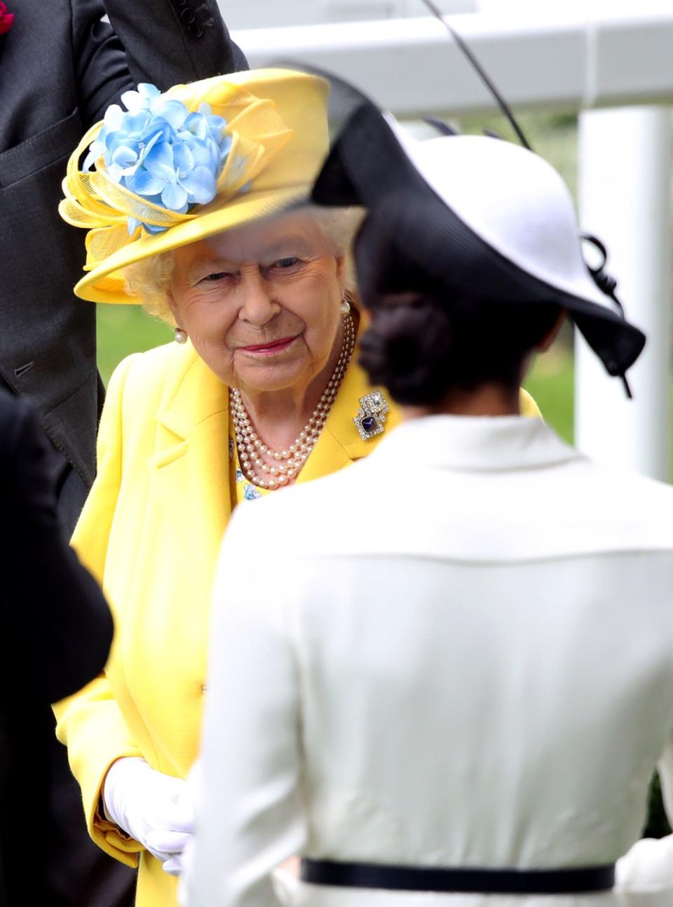 <p>A small smile from the Queen when she was chatting with her new granddaughter-in-law, Meghan, the Duchess of Sussex.</p>