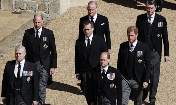 Prince William, Duke of Cambridge,center-left,Peter Phillips and Prince Harry, Duke of Sussex,march in the funeral procession of Prince Philip,Duke of Edinburgh to St George's Chapel in Windsor Castle in Windsor, England,April 17, 2021. (Adrian Dennis/POOL/AFP via Getty Images, FILE)