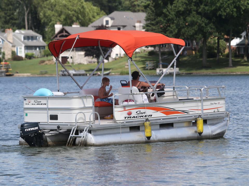 Boaters head out onto the waters Lake Cable in Jackson Township on Monday, July 25, 2022.