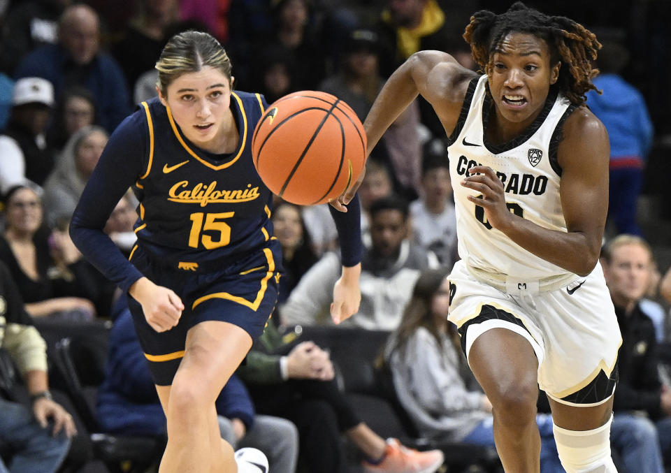 California guard Kemery Martin, left, and Colorado guard Jaylyn Sherrod pursue the ball during the first half of an NCAA college basketball game Friday, Jan. 12, 2024, in Boulder, Colo. (AP Photo/Cliff Grassmick)