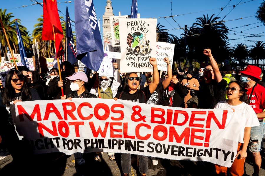 Protesters march along Market Street while demonstrating against the APEC (Asia-Pacific Economic Cooperation) Summit, Sunday, Nov. 12, 2023, in San Francisco. (AP Photo/Noah Berger)
