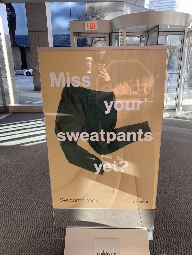 A third sign says "Miss your sweatpants yet?"