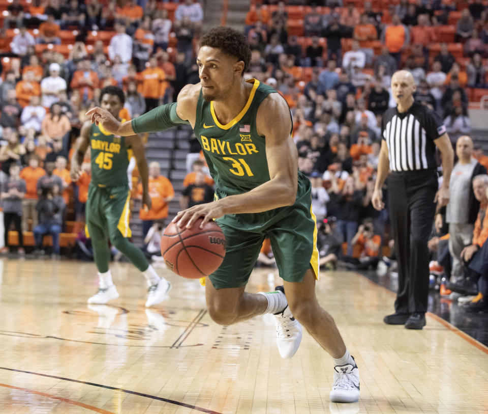 Baylor guard MaCio Teague (31) drives the ball during the second half of an NCAA college basketball game against Oklahoma State in Stillwater, Okla., Saturday, Jan. 18, 2020. (AP Photo/Brody Schmidt)